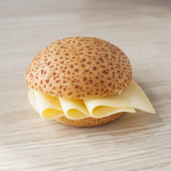 Cheese on  a roll. The roll is a "tiger bread" type, with a crunchy crust. It's sliced in half and cheese is in the middle. No other ingredients are used.