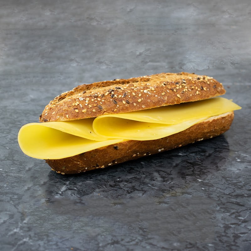 Cheese on  a small baguette. The bread is a "whole weat" type, with a crunchy crust. It's sliced in half and cheese is in the middle. No other ingredients are used.